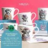 A display of six 380ml Fine China Cat Mugs features animal illustrations, including a dog and cow in decorative attire. Behind them are boxes labeled "380ml Fine China Mug." A circle on the display reads, "All packaging is recyclable," accompanied by a note about sustainable shipping.