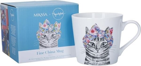 The 380ml Fine China Cat Mug boasts a black-and-white sketch of a cat elegantly embellished with a colorful floral headscarf. It comes beautifully packaged in a blue box that highlights the same delightful design.