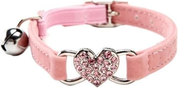 The Heart Bling Cat Collar with Safety Belt is a pink pet accessory that showcases a sparkling heart-shaped charm adorned with pink gems and comes with a silver bell, offering both style and security for your feline friend.