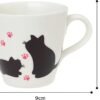 This Colour Changing Mug unveils enchanting black silhouettes of two cats with pink paw prints when hot liquid is poured into it. Standing 12 cm tall with a diameter of 9 cm, it adds a magical touch to your daily coffee routine.