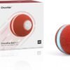 The image features a Puzzle Toy for Indoor Cat, an intelligent interactive toy ideal for indoor felines. The red ball, decorated with a silver emblem and light blue stripe, is positioned next to its packaging. The box emphasizes the ball's design along with branding text.