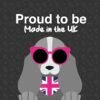 Featuring a sleek illustration of a gray dog sporting pink sunglasses and wearing a coat with a Union Jack pattern, the text above proclaims, 'Proud to be Made in the UK.' This stylish pup represents minimal shedding thanks to the Coat Shedding Comb, and stands against an elegantly dark background with subtle patterning.