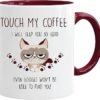 The Cat Mug - Touch My Coffee is designed with a maroon handle and interior and showcases a grumpy cartoon cat. It features the bold text, "Touch my coffee, I will slap you so hard even Google won't be able to find you," along with playful paw prints, bringing a humorous edge to your morning routine.