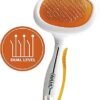 A pet grooming brush with an orange and white design, featuring "WAHL" on the handle. The Wahl Sensitive Skin Pet Slicker is perfect for sensitive skin, equipped with fine bristles and an orange emblem showcasing "DUAL LEVEL" in a stylized pattern of raised lines.