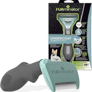 The FURminator Undercoat deShedding Tool Small for cats is shown with its packaging. It has a gray handle, blue-green comb head with metal teeth, and the packaging displays product info plus a cat image.